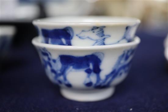 Six 19th century Chinese blue and white horses tea bowls and a later blue and white tray, length 16cm